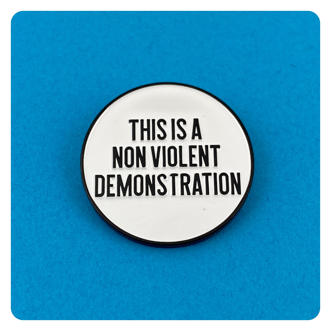 This is a Non Violent Demonstration Enamel Pin